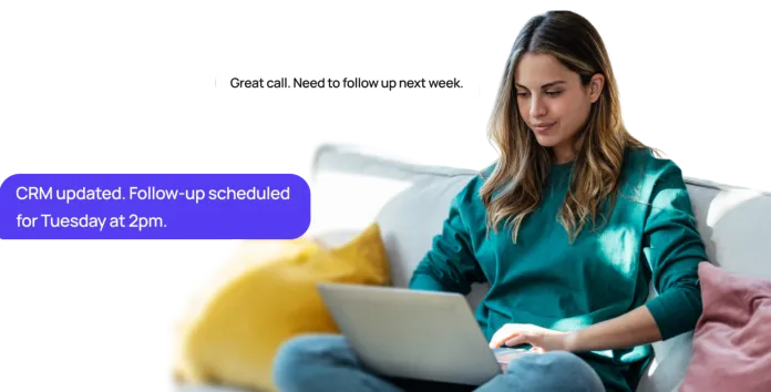 Agent on a couch with a laptop while Shilo updates the CRM and schedules the follow-up