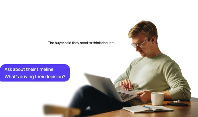 Real estate agent working on a laptop as Shilo suggests asking the buyer about their timeline