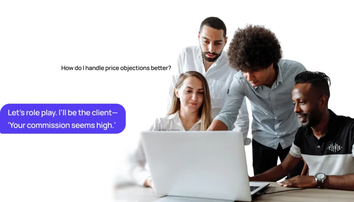 Team of agents around a laptop role playing a commission objection with Shilo as the client